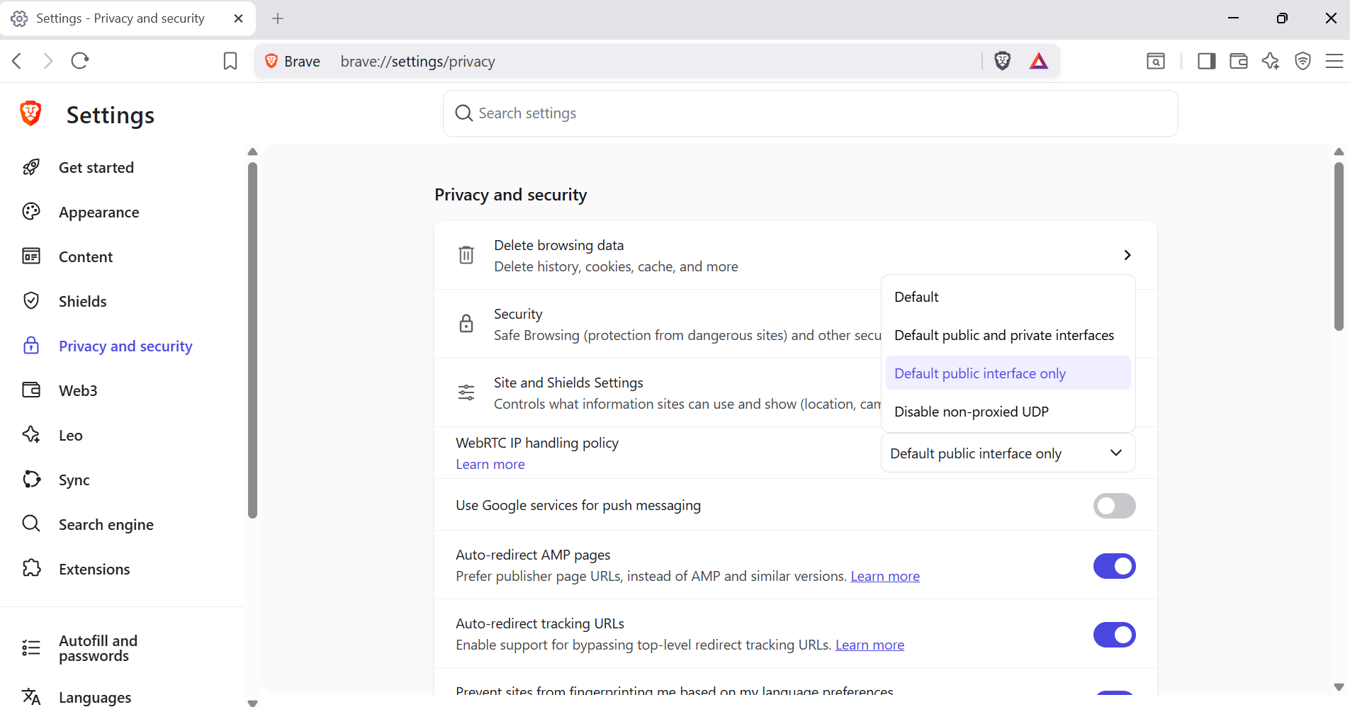 Brave browser Privacy and security settings showing WebRTC IP handling policy dropdown open with all four options visible and Default public interface only highlighted as the selected option